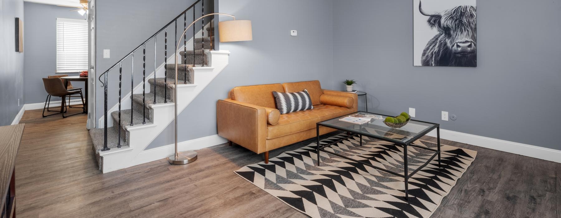 a living room with a staircase